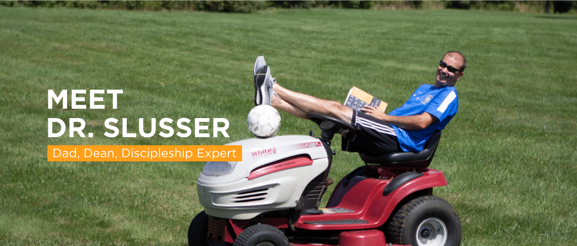 Wayne Slusser riding lawnmower
