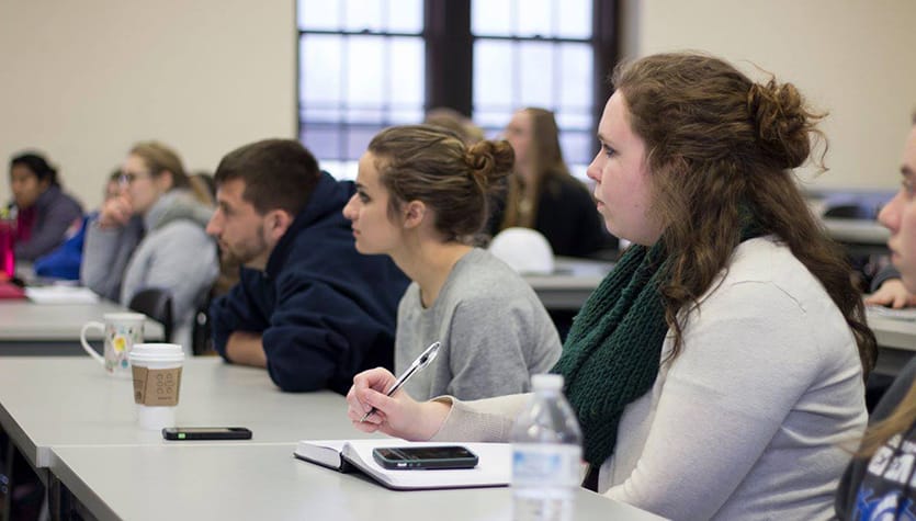 Students listening to an alumnus